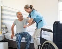 Caregiver giving individual attention to an elderly resident in a senior home